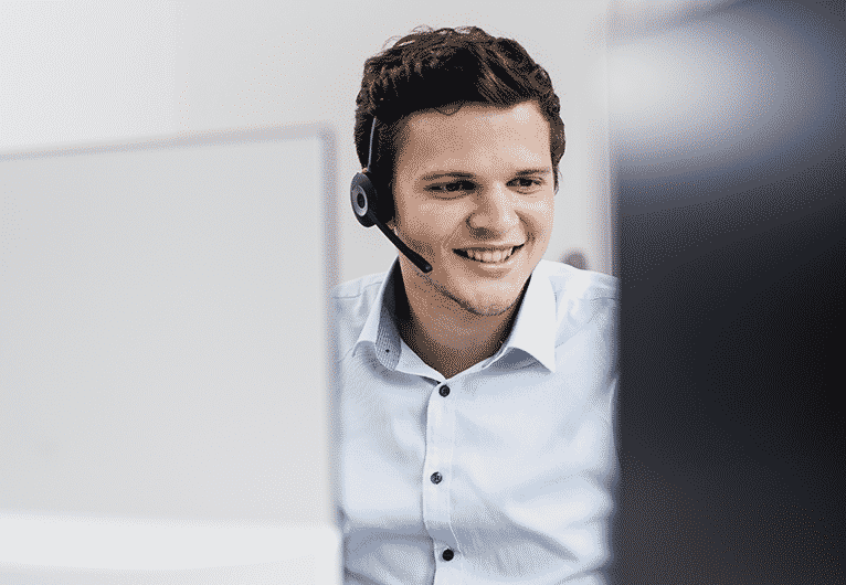 Young male coworker with headset